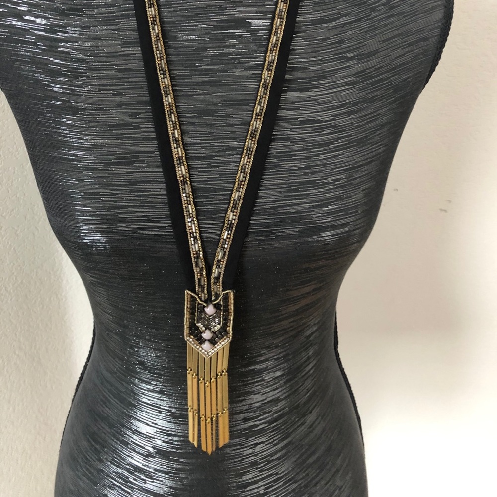 Mid-length gold fringe statement necklace